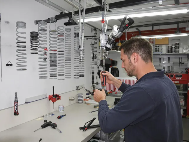Milford Garage Door Repair safety certified technician performing precision spring replacement in Milford