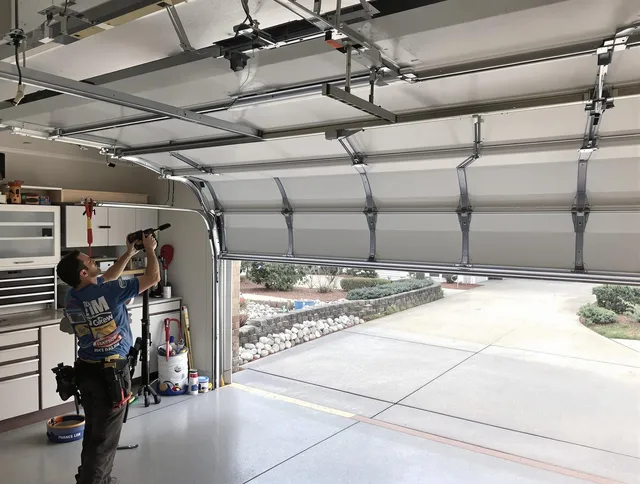 Garage door track repair service by Milford Garage Door Repair in Milford